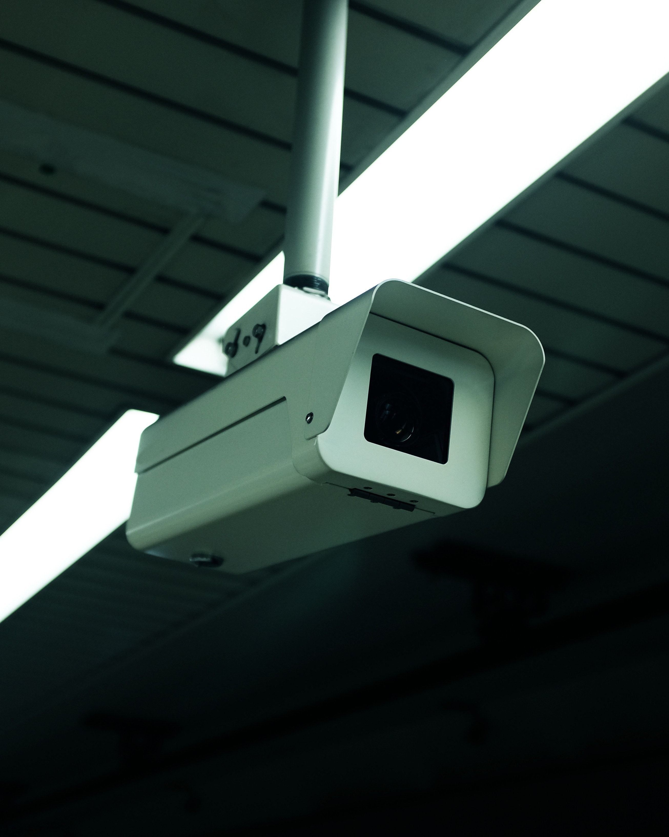 Ceiling-mounted CCTV camera in a commercial building